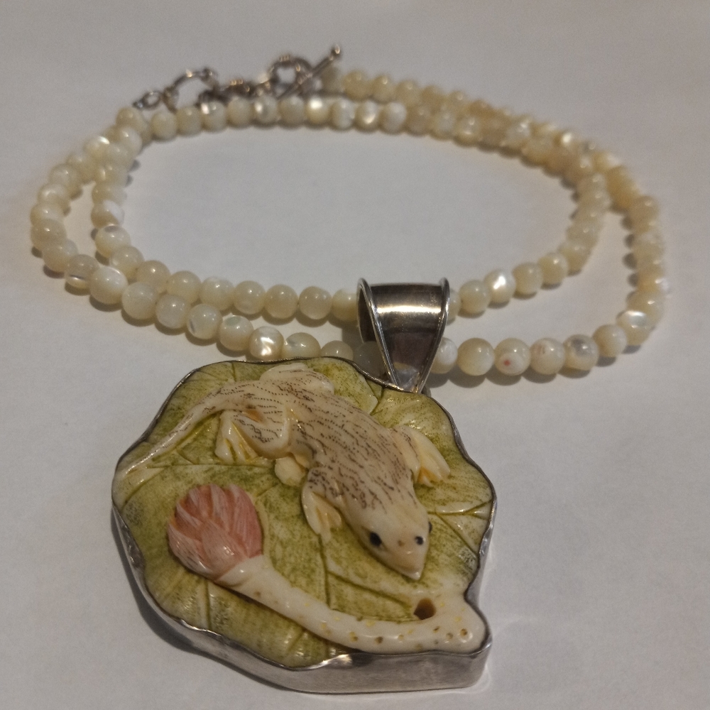 Hand crafted salimander necklace carved of bone. 925 silver frame and clasp